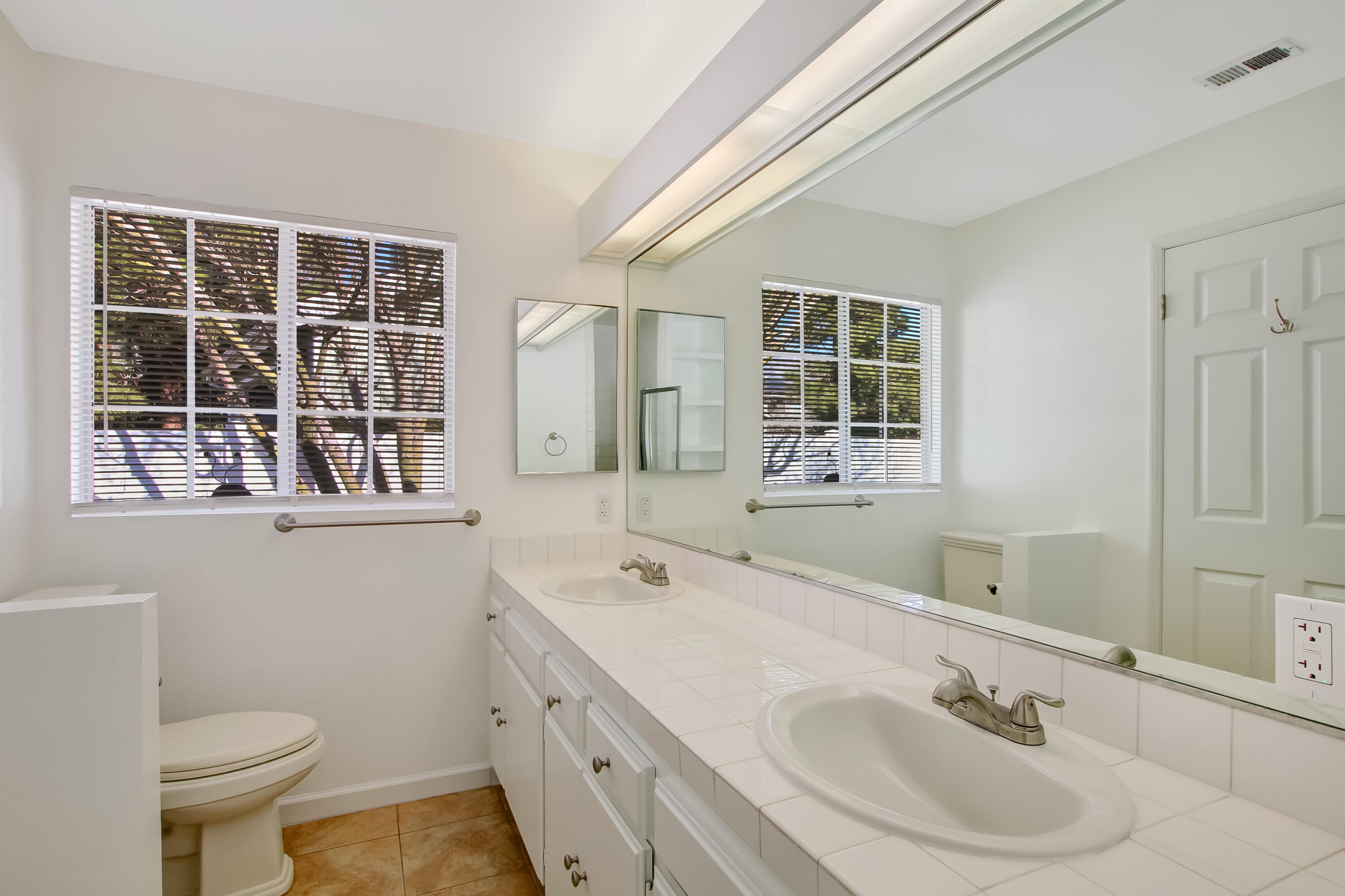 1541 Meadow Circle Carpinteria, CA 93013 - Photo 33 of 36 a bathroom with a sink and a mirror