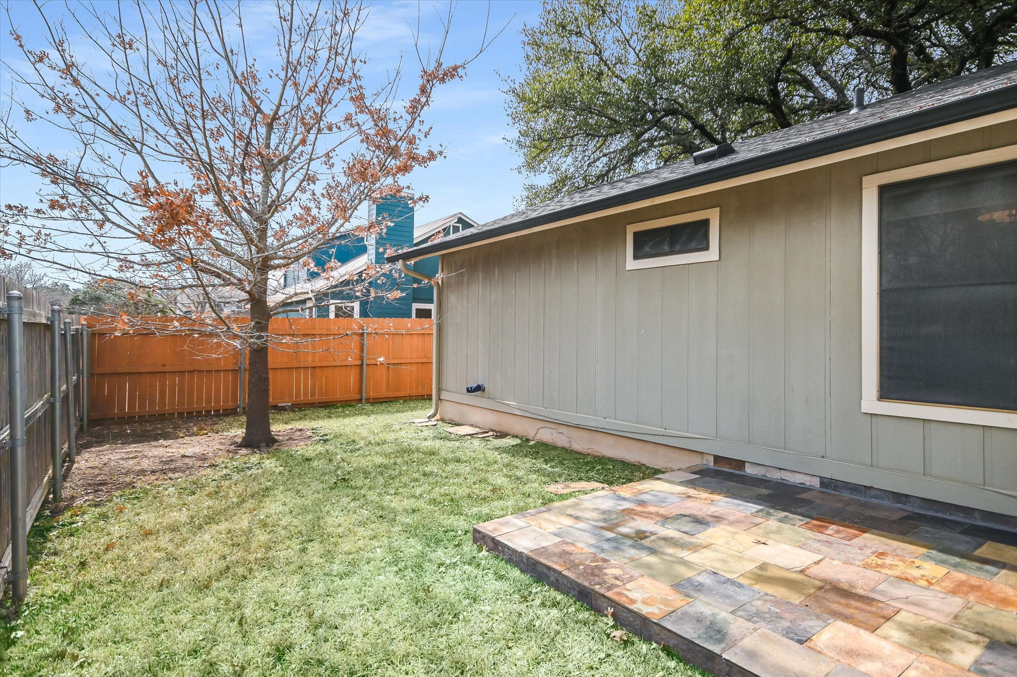 7701 Grovedale Trail Austin, TX 78729 - Photo 12 of 13 View of fenced backyard