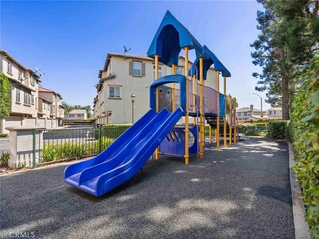 a view of street with tall buildings