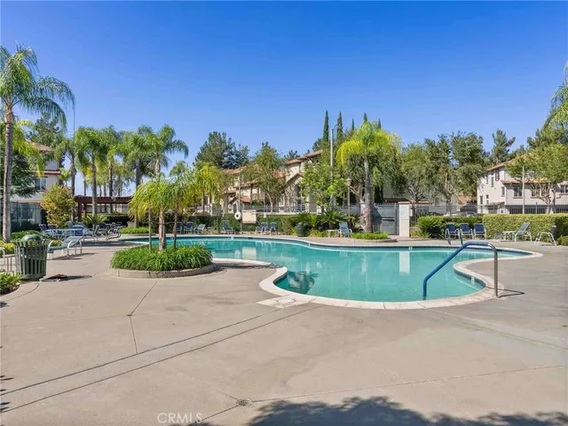 a view of a park with large trees