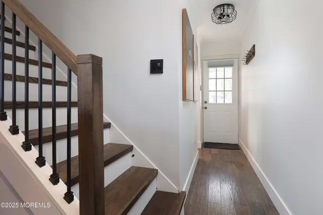 a view of entryway with wooden floor