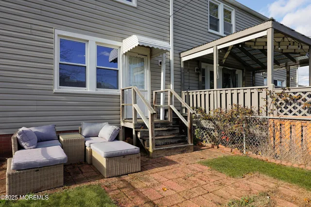 a view of two chairs in the patio