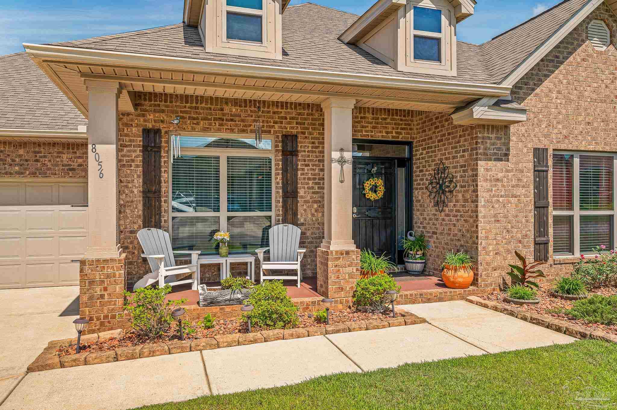 a view of a building with sitting area
