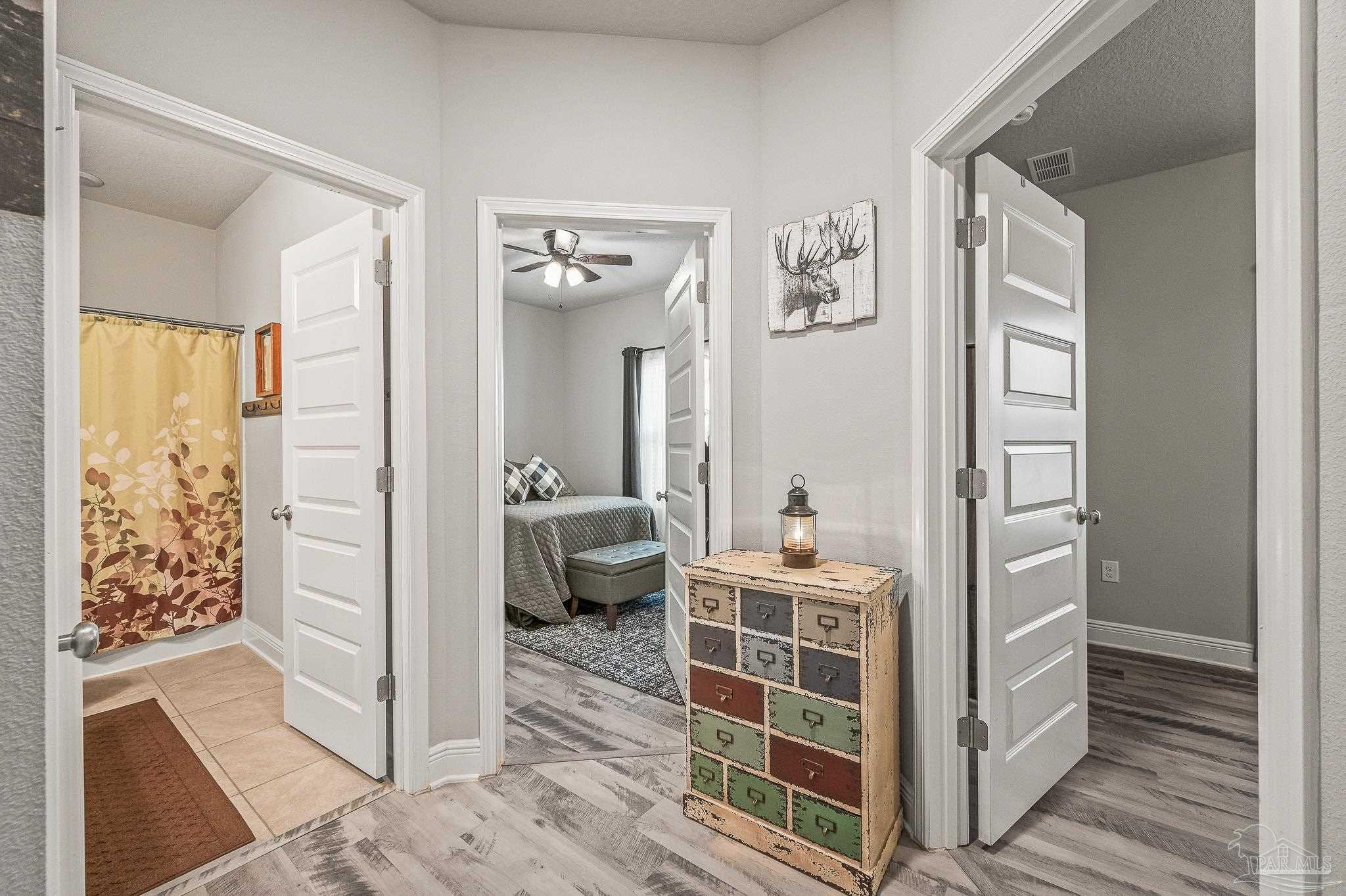 8056 Stream Ridge Road Pensacola, FL 32526 - Photo 14 of 71 a bedroom with a bed and a view of bedroom