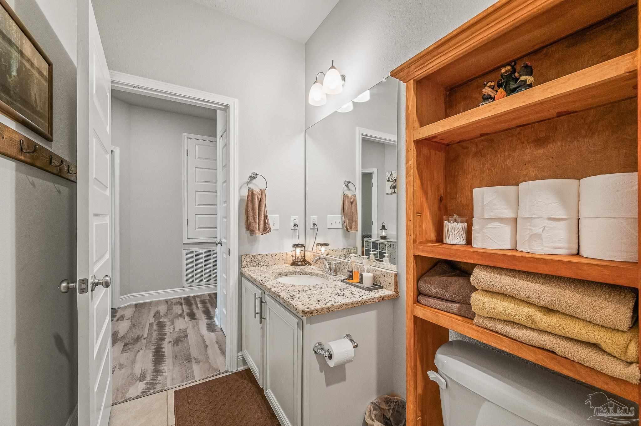 8056 Stream Ridge Road Pensacola, FL 32526 - Photo 20 of 71 a bathroom with a sink and a mirror