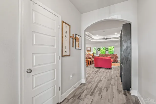 a bedroom with furniture and wooden floor