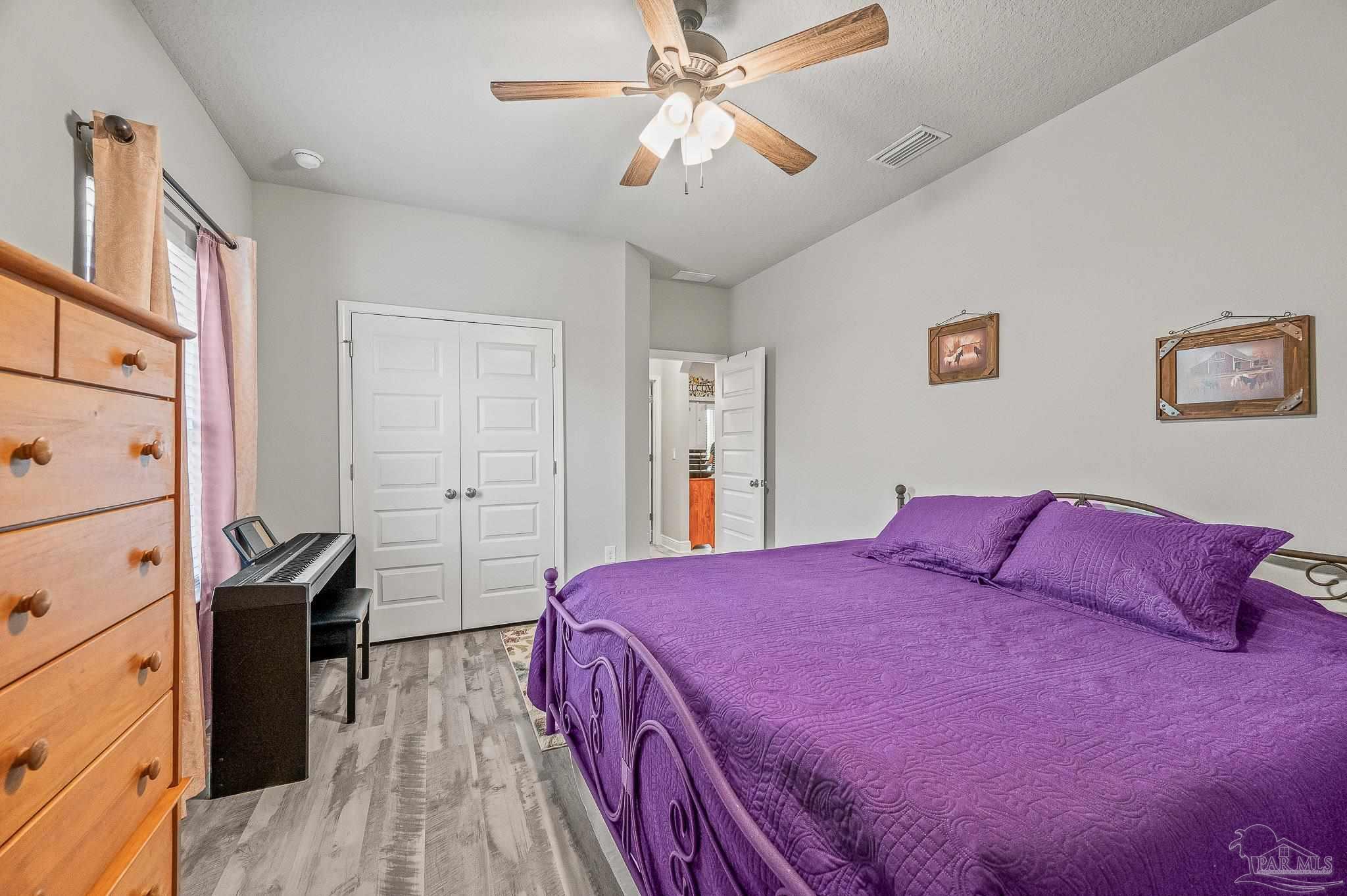 8056 Stream Ridge Road Pensacola, FL 32526 - Photo 25 of 71 a bedroom with a bed and a closet