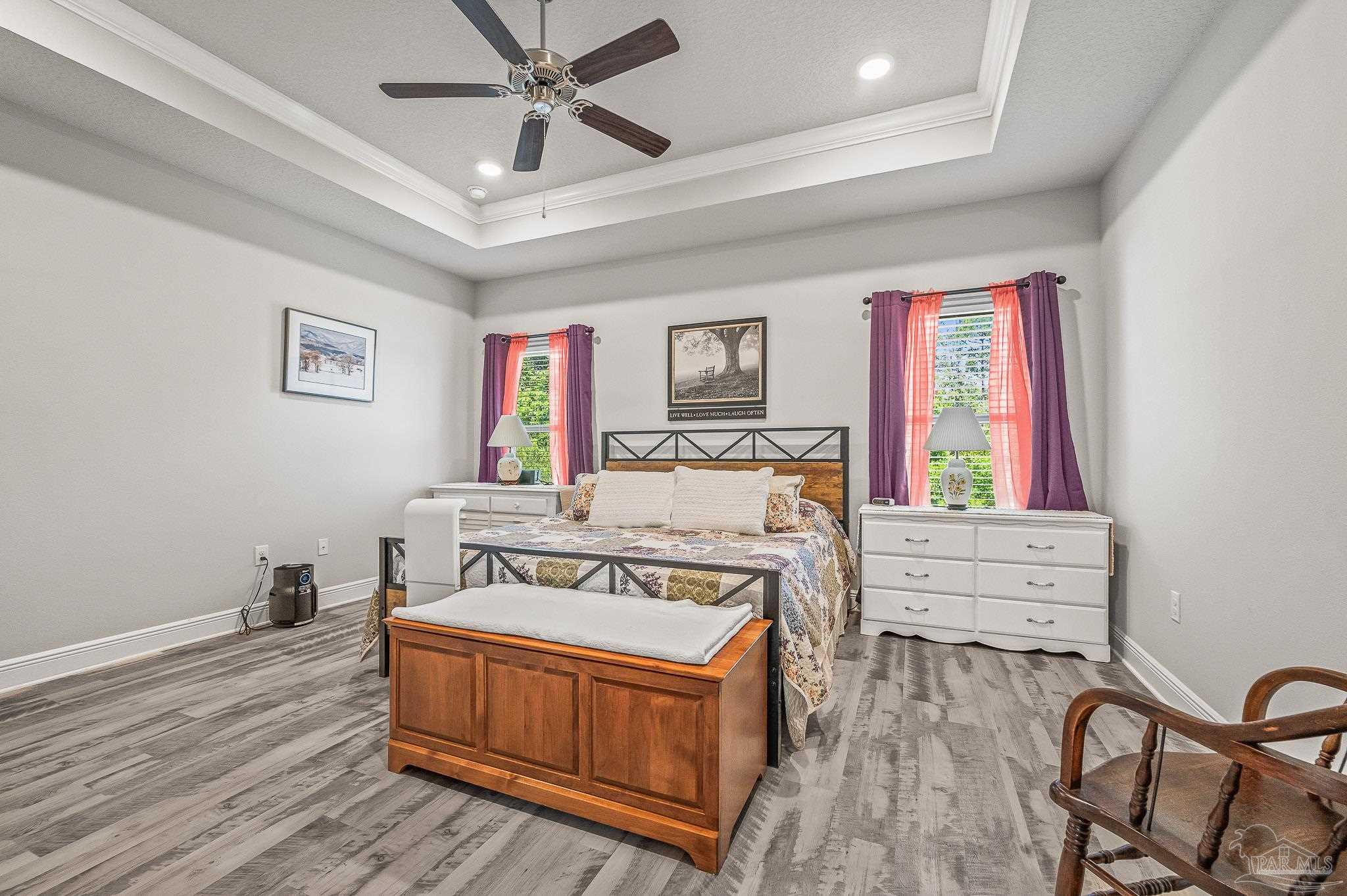 8056 Stream Ridge Road Pensacola, FL 32526 - Photo 31 of 71 a bedroom with furniture and wooden floor