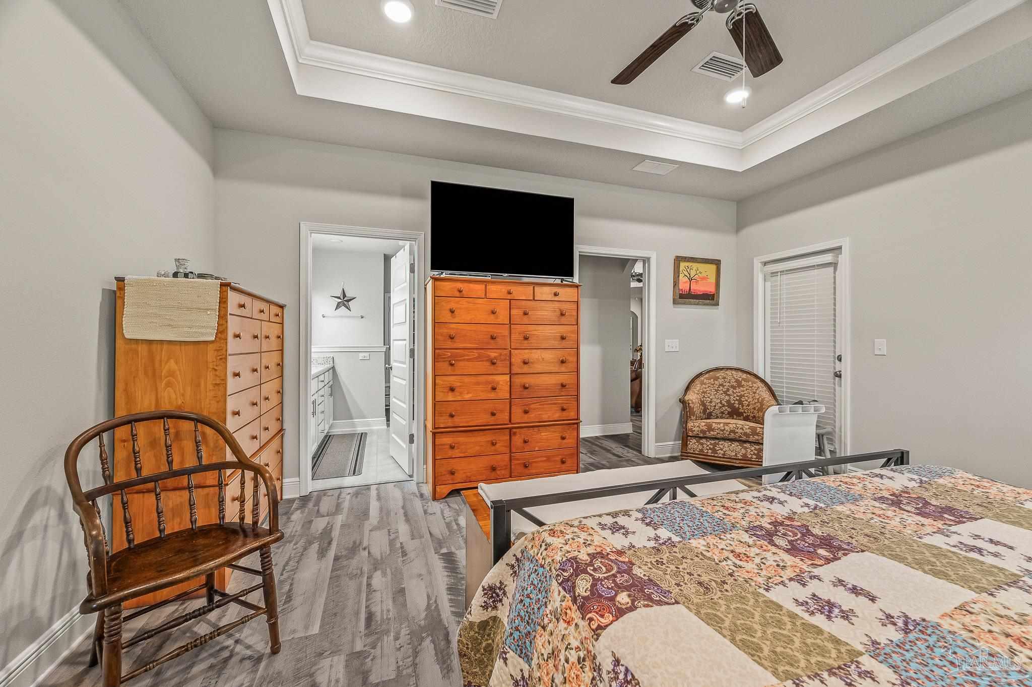 8056 Stream Ridge Road Pensacola, FL 32526 - Photo 32 of 71 a bedroom with furniture and wooden floor