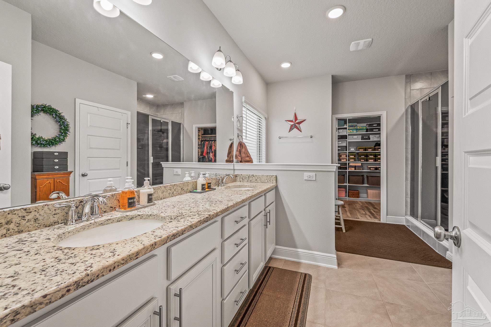 8056 Stream Ridge Road Pensacola, FL 32526 - Photo 33 of 71 a bathroom with a sink double vanity and a shower