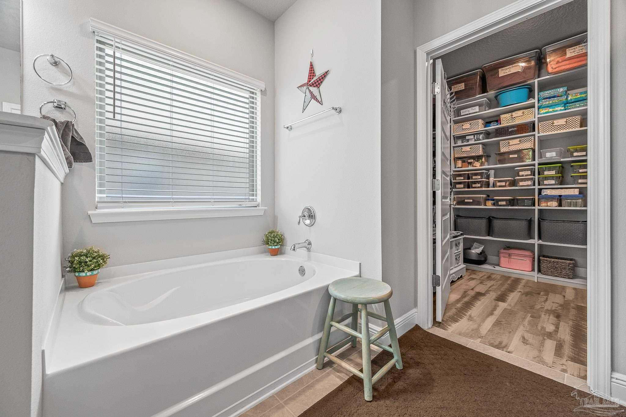 8056 Stream Ridge Road Pensacola, FL 32526 - Photo 35 of 71 a bathroom with a bathtub and a shower