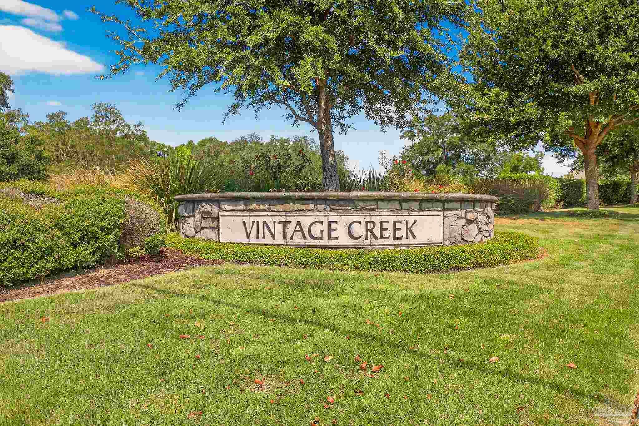 8056 Stream Ridge Road Pensacola, FL 32526 - Photo 4 of 71 a view of a big yard with an tree