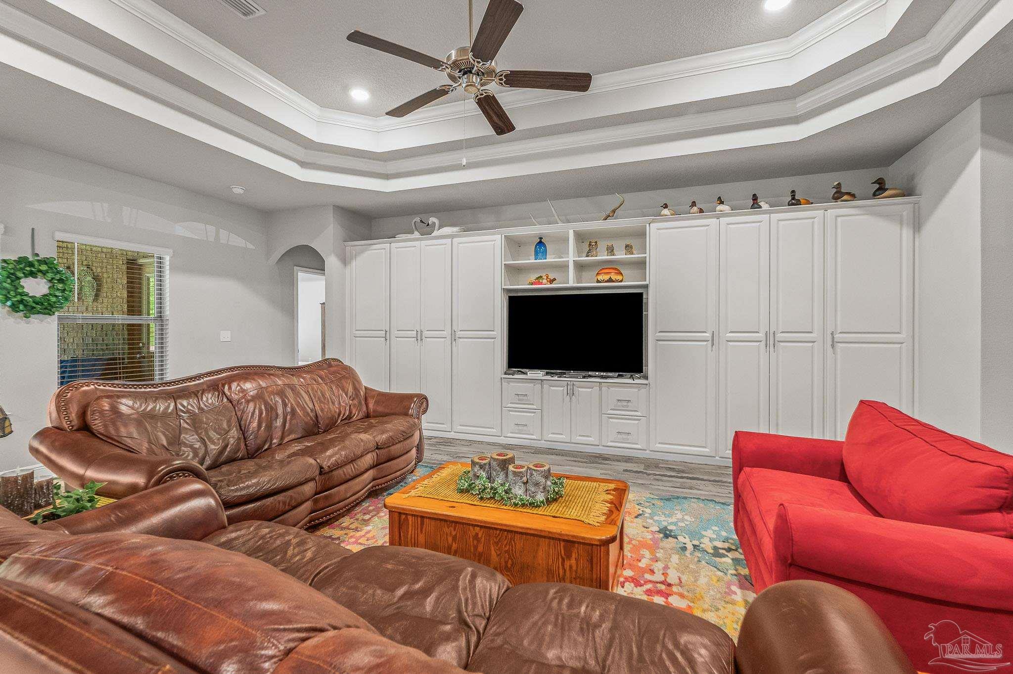 8056 Stream Ridge Road Pensacola, FL 32526 - Photo 47 of 71 a living room with furniture and a flat screen tv