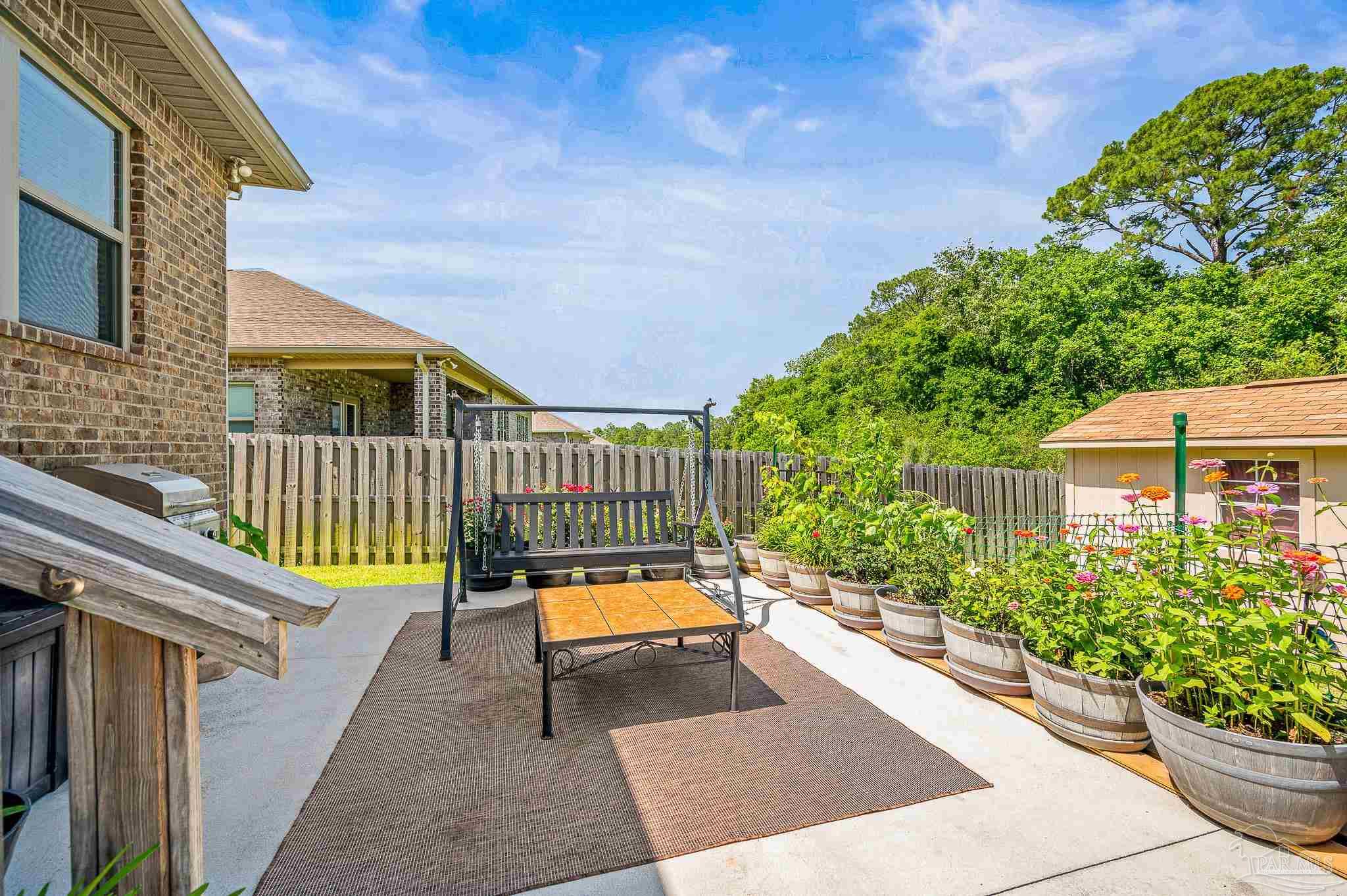 8056 Stream Ridge Road Pensacola, FL 32526 - Photo 51 of 71 a view of a chairs and table in the balcony