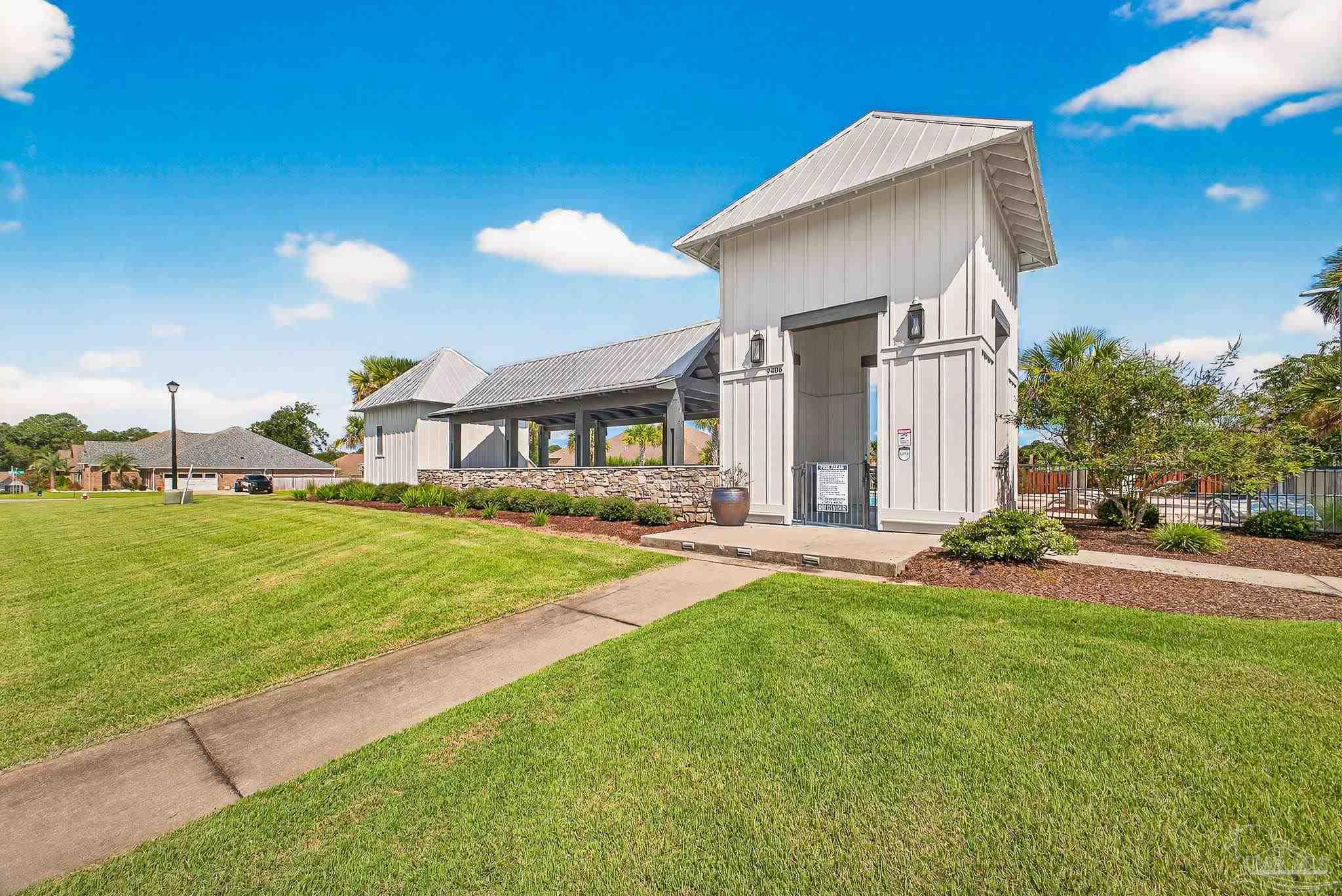8056 Stream Ridge Road Pensacola, FL 32526 - Photo 70 of 71 a front view of a house with a yard