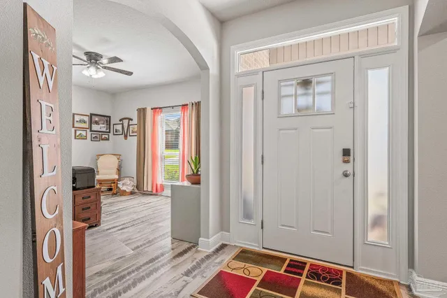 a bedroom with a bed and a view of bedroom