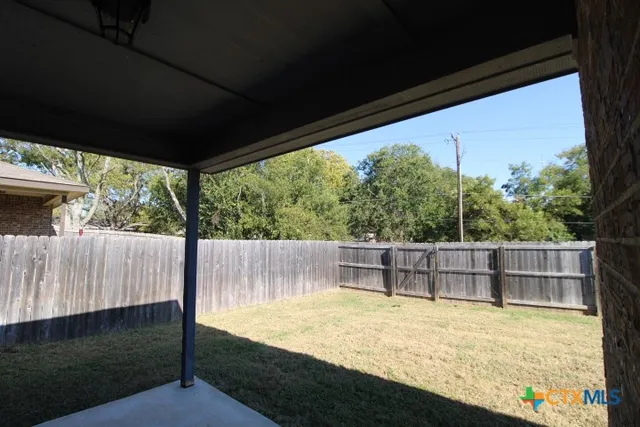 a view of outdoor space with swimming pool and sitting space