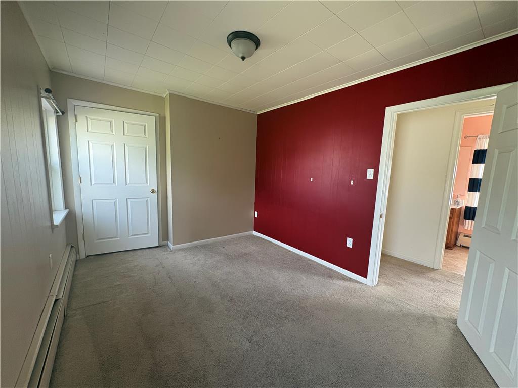 7281 Decatur Street New Tripoli, PA 18066 - Photo 19 of 27 A well-lit room with plush carpeting and a striking accent wall awaits your personal touch.