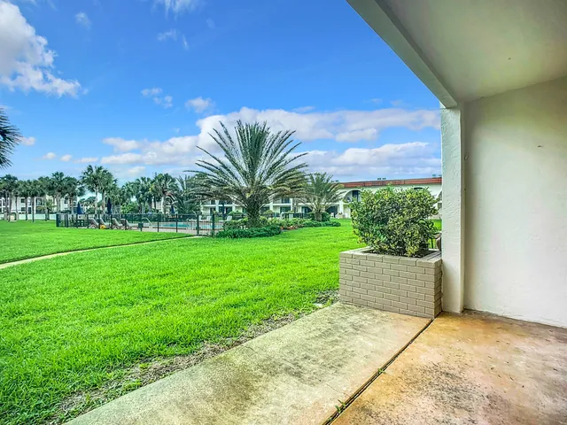 a view of a house with a big yard