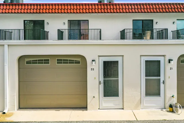 a front view of a house with a garage