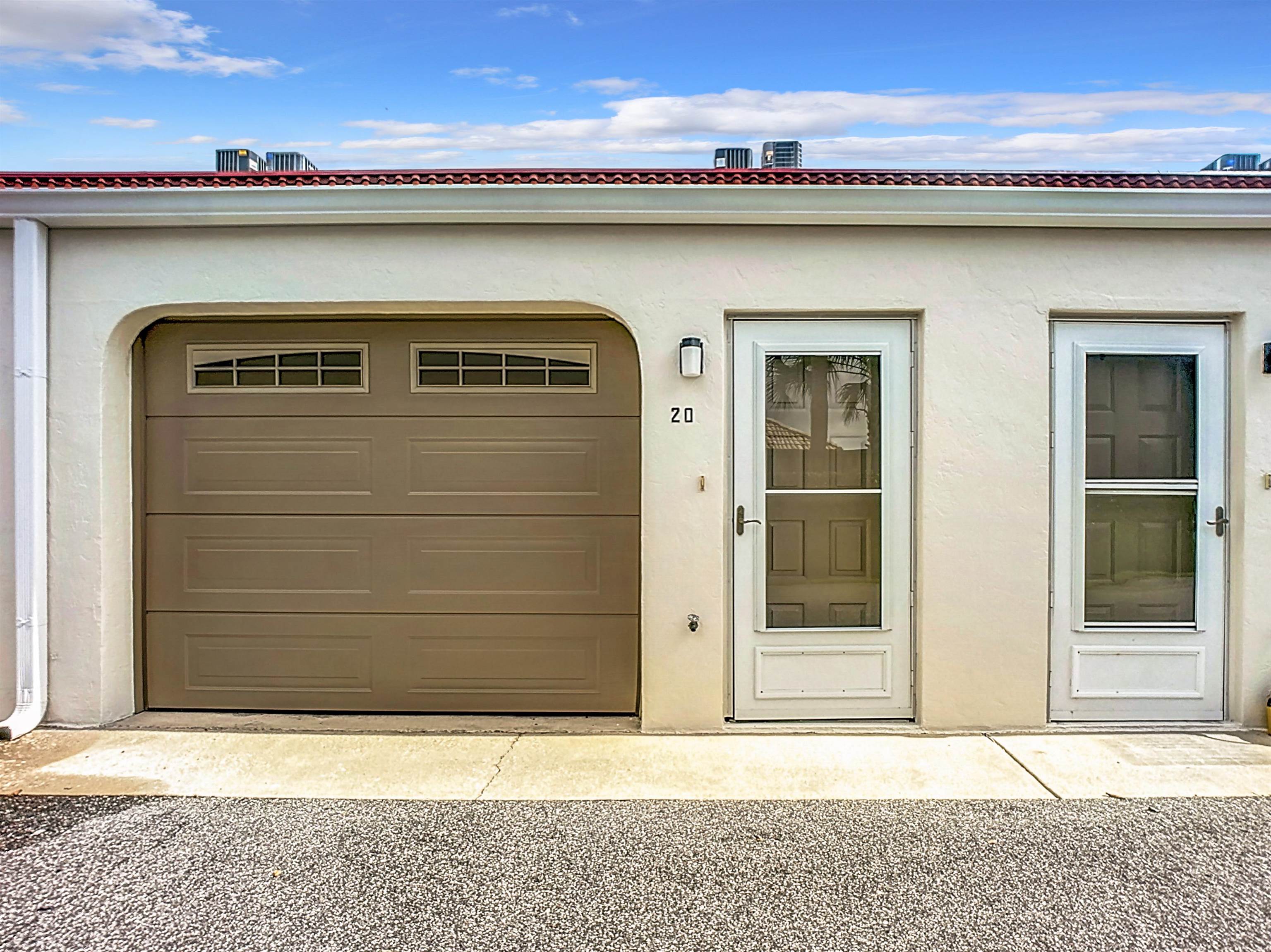 21 Dondanville Road, Unit 20 St. Augustine, FL 32080 - Photo 6 of 33 a front view of a house with a garage