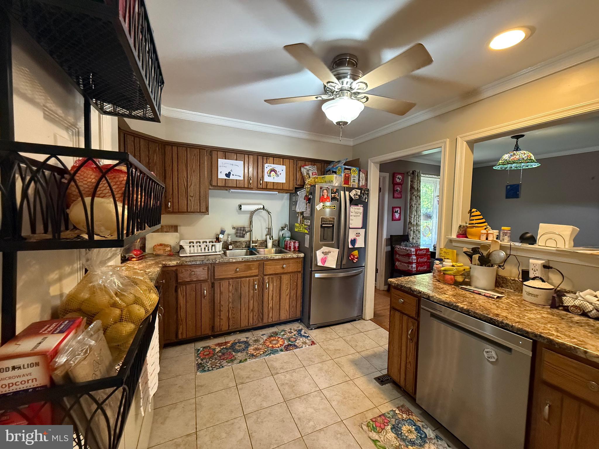 1214 Johnson Road Salisbury, MD 21804 - Photo 22 of 59 a kitchen with a sink and a refrigerator