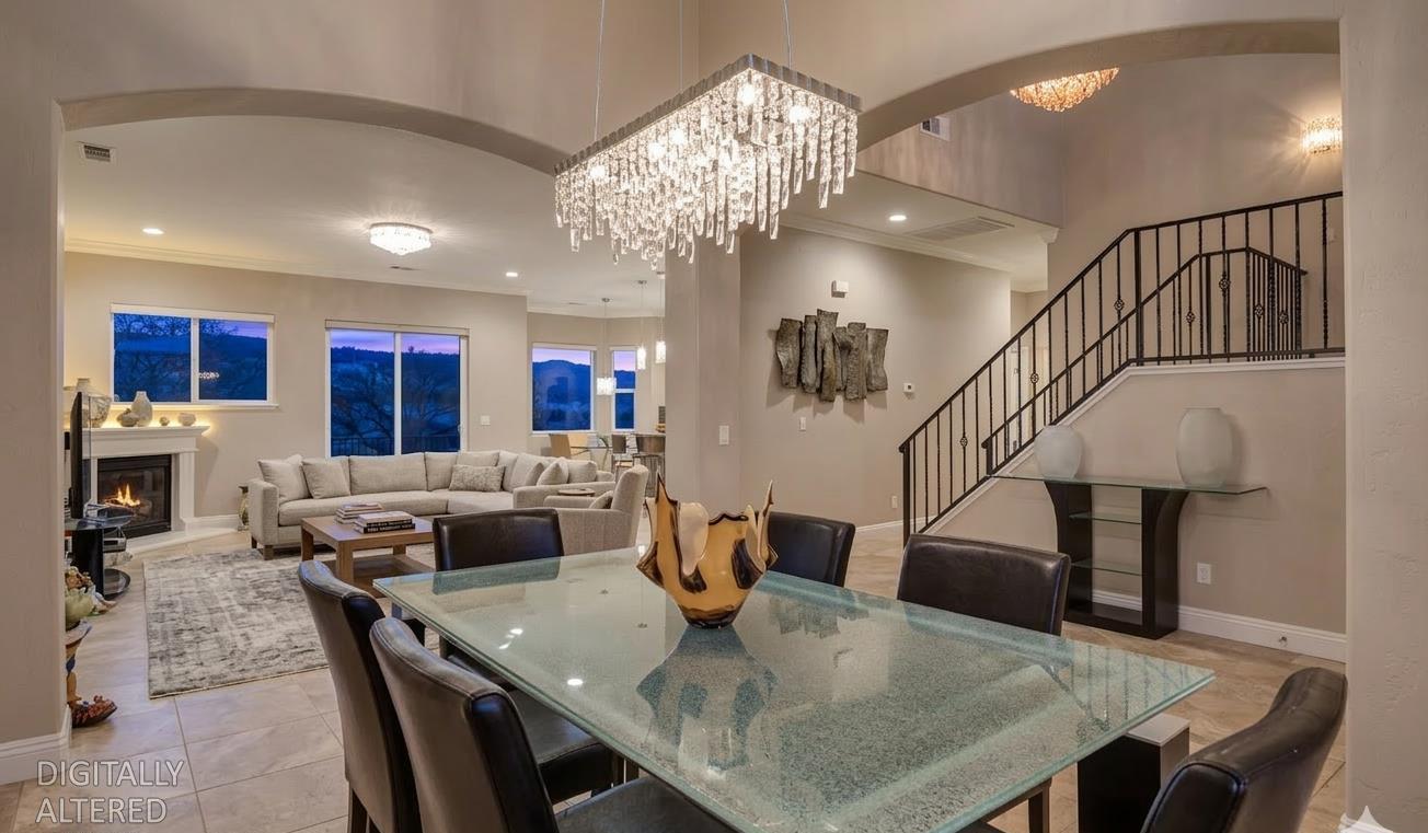 78 Aphrodite Court Copperopolis, CA 95228 - Photo 11 of 98 a living room with dining table furniture and a chandelier