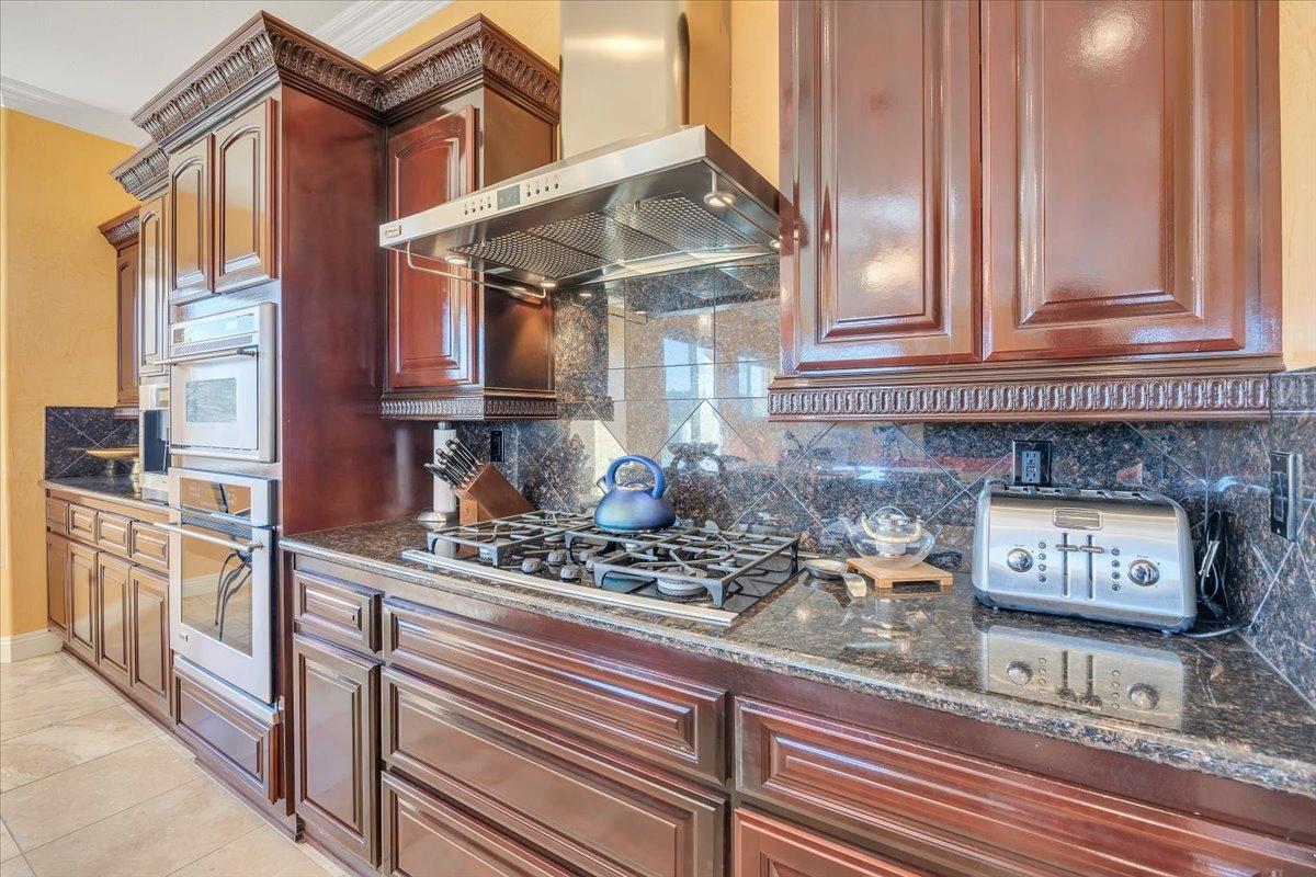 78 Aphrodite Court Copperopolis, CA 95228 - Photo 25 of 98 a kitchen with stainless steel appliances granite countertop a stove and a sink