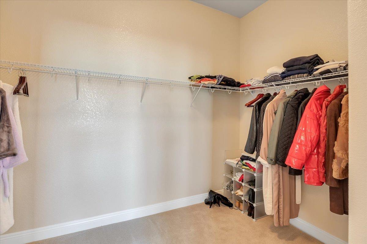 78 Aphrodite Court Copperopolis, CA 95228 - Photo 40 of 98 a view of walk in closet with clothes