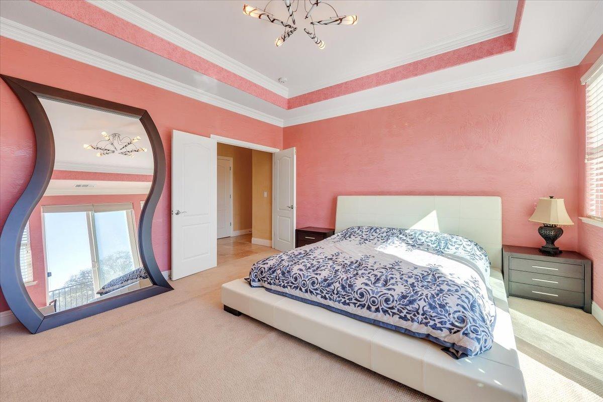 78 Aphrodite Court Copperopolis, CA 95228 - Photo 43 of 98 a bedroom with a bed and a mirror