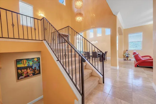 an aerial view of a city with lots of residential buildings and lake view in back