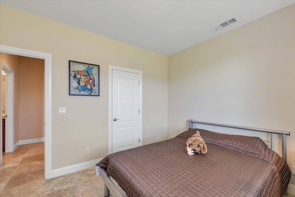 78 Aphrodite Court Copperopolis, CA 95228 - Photo 58 of 98 a bedroom with a bed and cabinets