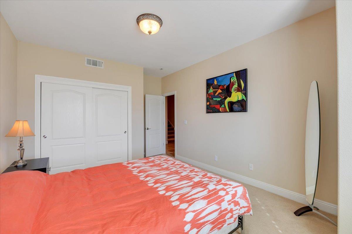 78 Aphrodite Court Copperopolis, CA 95228 - Photo 60 of 98 a bedroom with a bed and a painting on the wall