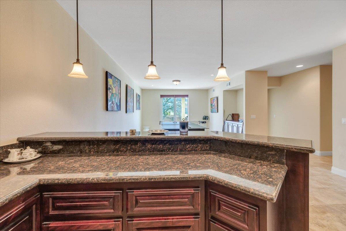 78 Aphrodite Court Copperopolis, CA 95228 - Photo 65 of 98 a kitchen with a stove and a sink with cabinets