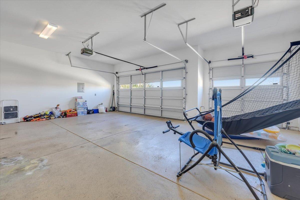 78 Aphrodite Court Copperopolis, CA 95228 - Photo 76 of 98 Expansive, 3-car garage with openers and basketball game.