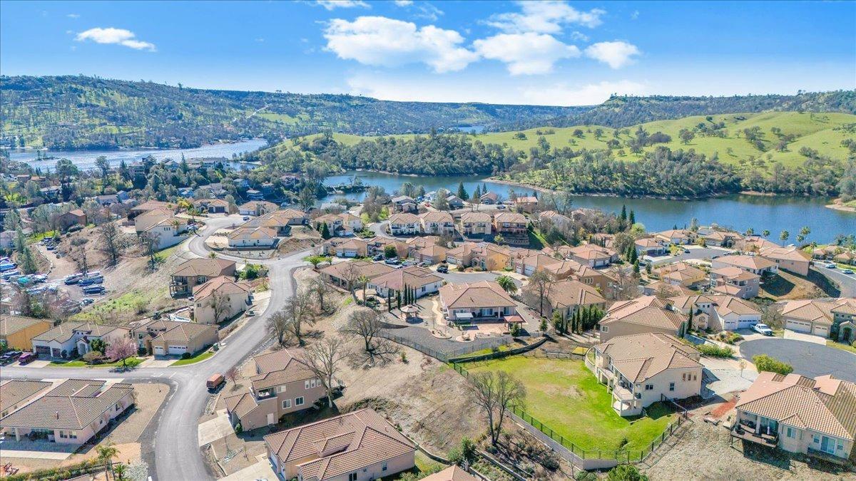 78 Aphrodite Court Copperopolis, CA 95228 - Photo 78 of 98 an aerial view of a city with lots of residential buildings and lake view in back