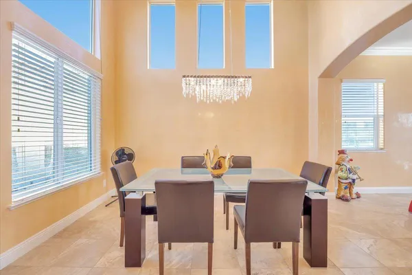 a living room with furniture fireplace and a large window
