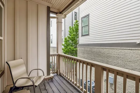 a view of a balcony with furniture