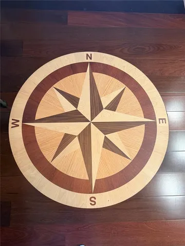 a view of a livingroom with furniture and a floor to ceiling window