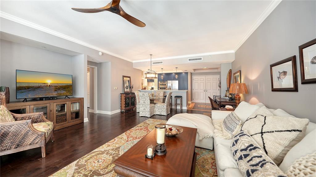 50 Central Avenue, Unit 14B Sarasota, FL 34236 - Photo 16 of 69 a living room with furniture and a flat screen tv