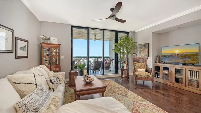 a bedroom with a bed and large mirror with a flat tv screen