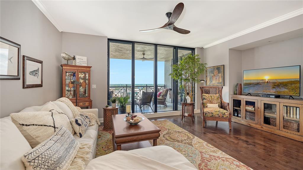 50 Central Avenue, Unit 14B Sarasota, FL 34236 - Photo 19 of 69 a living room with furniture and a flat screen tv