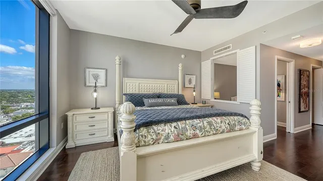 a spacious bathroom with a granite countertop sink toilet and shower