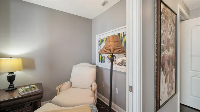 a spacious bathroom with a granite countertop sink a toilet a mirror and bathtub