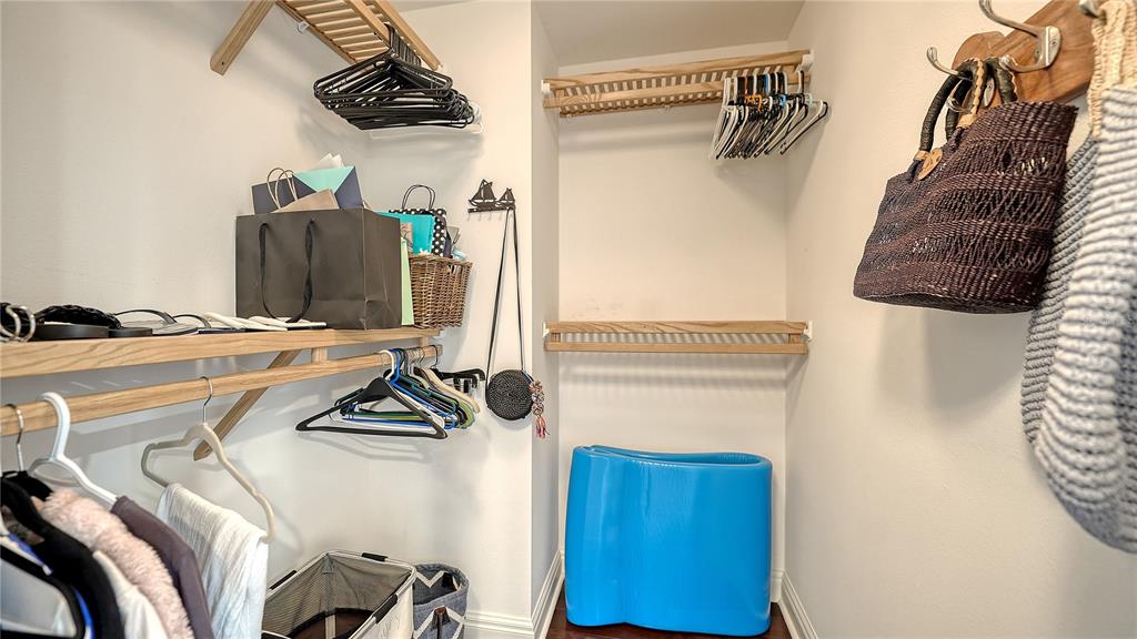 50 Central Avenue, Unit 14B Sarasota, FL 34236 - Photo 29 of 69 a view of walk in closet with clothes and shoes