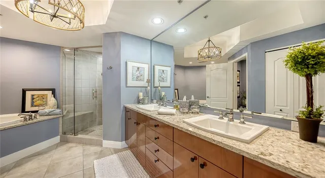 a bedroom with a bed and wall painting