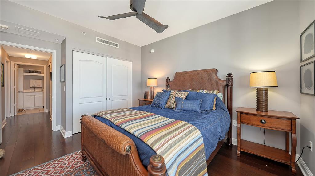 50 Central Avenue, Unit 14B Sarasota, FL 34236 - Photo 37 of 69 a bedroom with a bed and a lamp