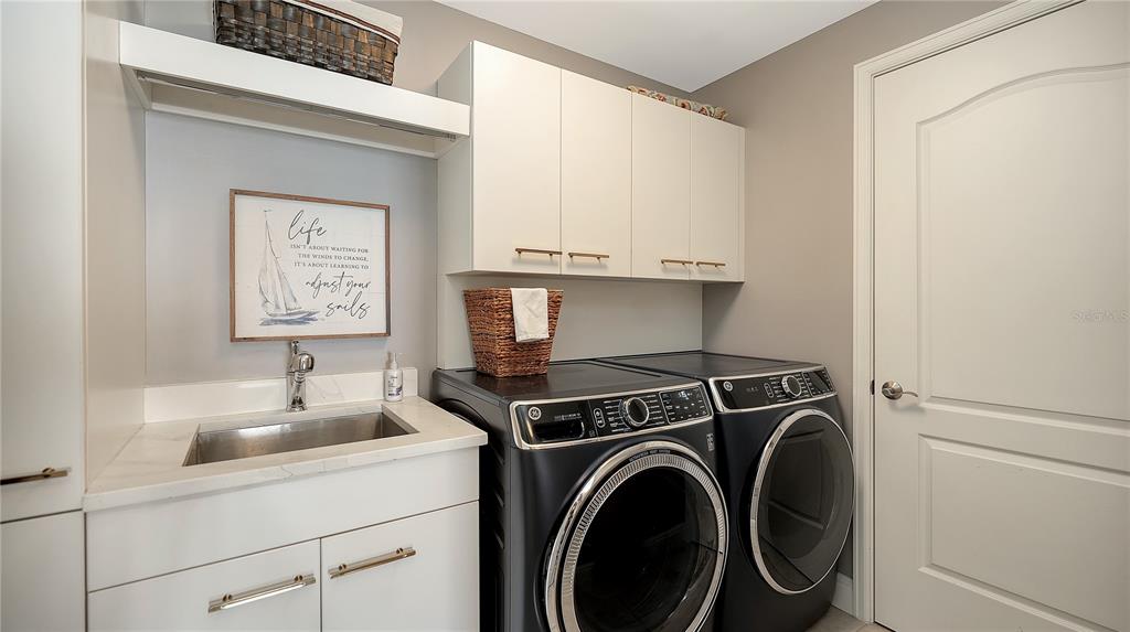 50 Central Avenue, Unit 14B Sarasota, FL 34236 - Photo 41 of 69 a view of a sink and washer and dryer