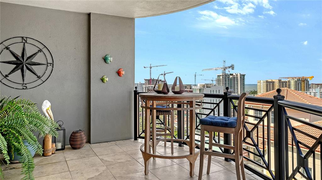 50 Central Avenue, Unit 14B Sarasota, FL 34236 - Photo 44 of 69 a view of a chairs and table in the balcony