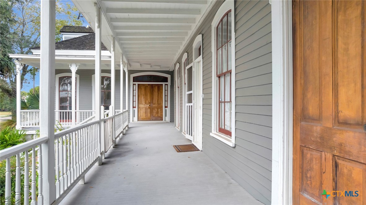 502 North Liberty Street Victoria, TX 77901 - Photo 6 of 17 a view of a porch with wooden floor and stairs